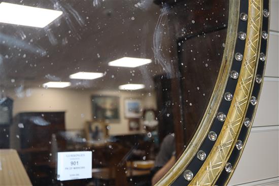 A pair of Irish style oval mirrors with glass-mounted gilt and ebonised frames H.105cm